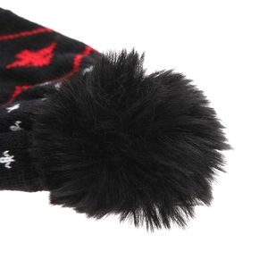 Detailed close-up of a black faux fur pom-pom on a festive Christmas knit hat for kids