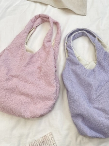 Pink and purple textured puff tote bags with minimalist ruffled fabric design