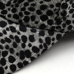 Close-up of leopard print baseball cap showing detailed twill fabric and high-quality stitching