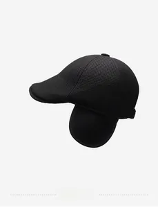 Detail of black winter flat cap with ear flaps and Style embroidery on waffle fabric