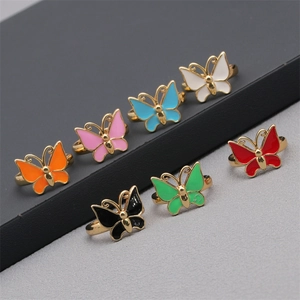 Detail of colorful butterfly rings in gold-plated alloy with vibrant enamel finish