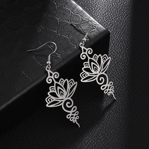 Hollow lotus drop earrings in polished stainless steel with elegant ear hook design