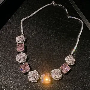 Macro view of luxury necklace featuring pink princess cut stones and rose diamond details
