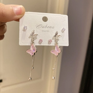 Close-up of S925 silver butterfly earrings set with pink and clear zircon stones