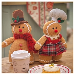 Detailed view of standing plush gingerbread man dolls in a festive dining setting