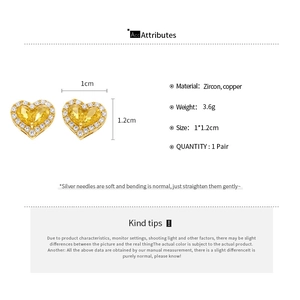 Detail view of yellow heart earrings with dimensions and material specifications