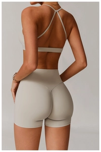 Rear view of quick-dry yoga bra with cross back straps and high-waisted shorts set