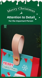 Detail of Christmas gift box featuring a pink leather handle with gold metal rivets