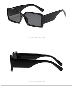 Macro detail of retro square black sunglasses with wide temples and dark lenses