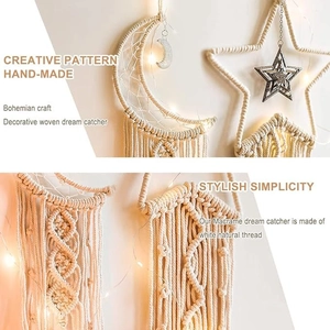 Detail of bohemian handmade moon and star dreamcatchers with white cotton tassels