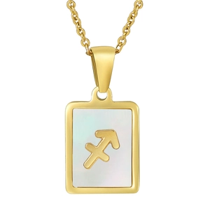 Macro view of gold Sagittarius pendant with white mother of pearl inlay and polished finish