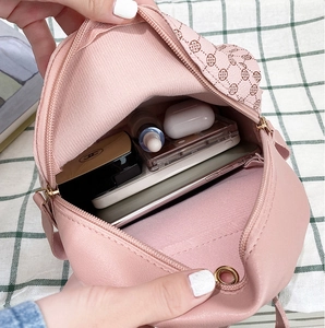 Detailed interior of pink PU mini crossbody bag with clover print and spacious storage
