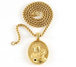 Macro detail of 18k gold plated 3D relief Virgin and Child pendant with polished chain