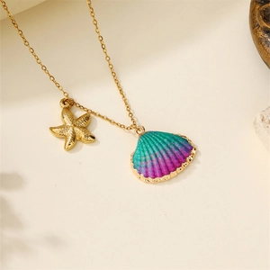 Close-up of golden starfish and colorful gradient shell pendants on a thin link chain