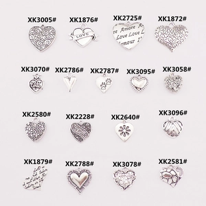 Assorted alloy heart charms in various designs for DIY jewelry and necklace crafting