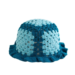 Handmade crochet bucket hat with blue contrast ruffles and wave brim design
