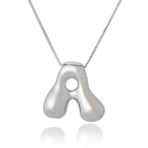 Macro shot of silver letter A bubble pendant necklace with polished mirror surface