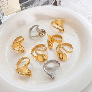 Irregular geometric wavy rings in gold and silver finish with a modern minimalist design