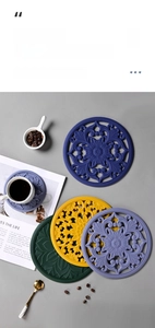 Detailed view of hollow silicone heat resistant placemats with baroque floral patterns