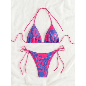 Detailed flat lay of pink and blue tie-dye bikini set with side-tie triangle bottoms