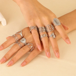 Set of minimalist silver stainless steel rings with geometric and vintage boho designs