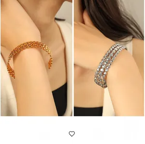 Macro detail of exaggerated gold and silver woven texture wide cuff bracelets