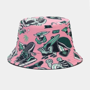 Close-up of pink bucket hat with vibrant graffiti prints and durable canvas texture