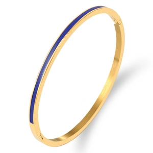 Detailed macro view of 3mm gold-plated titanium steel bangle with blue enamel finish