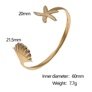 Detail view of gold starfish and shell bangle with 60mm diameter and 7.7g weight info