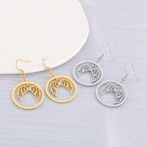 Detail of round hollow angel wing drop earrings in polished gold and silver finishes