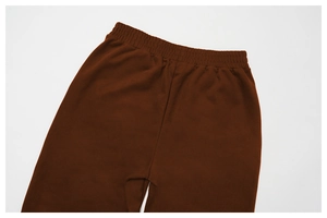 Close-up of the elastic waistband and neat stitching on brown high-waisted sweatpants