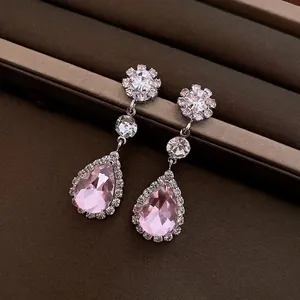 Elegant floral drop earrings set with pink pear-shaped crystals and sparkling zircons