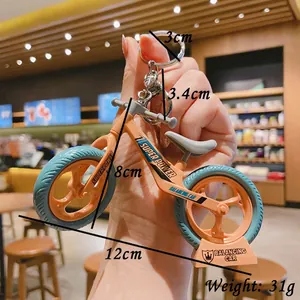 Mini orange and blue assembly bicycle keychain with metal carabiner for bags