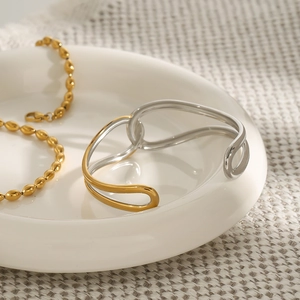 Minimalist knot design 18K gold and silver two-tone stainless steel open bangle for women