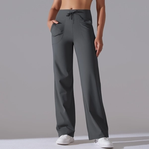 Detail view of high waist yoga pants showing side pockets and drawstring closure