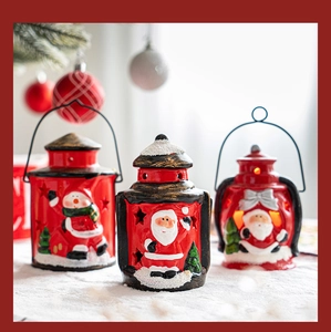 Detail of handcrafted ceramic Christmas lanterns with hollow stars and metal handles