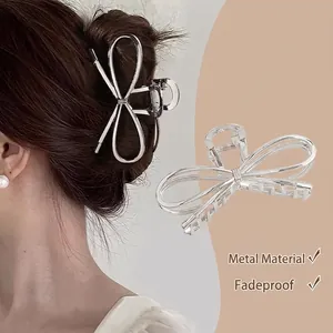 Elegant silver metal bow claw clip for women's hair styling and large volume buns