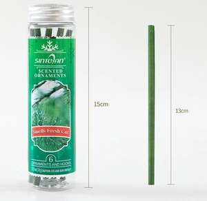 Detail view of green pine scented ornaments with clear 13cm and 15cm size measurements