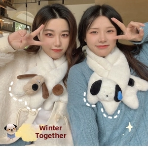 Close-up of soft plush scarves featuring cute cartoon dog head charms and furry texture