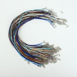 Detailed view of colorful wax cord necklaces with silver lobster clasps and extenders