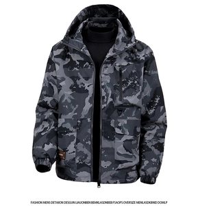 Detailed view of camo jacket showing the zipper pocket and leather brand patch accent
