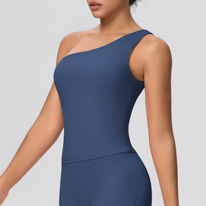 Detail of navy blue one-shoulder sports bra showing seamless elastic fabric and fit