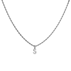 Macro shot of silver twisted chain necklace with a zircon-inlaid letter S pendant