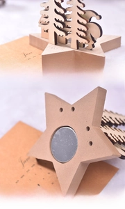 Detail view of the back and bottom of a wooden Christmas tree candle holder centerpiece