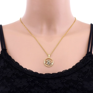 Detailed close-up of 18K gold plated evil eye pendant with sparkling blue zircons