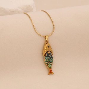 Macro shot of 3D articulated fish pendant with colorful enamel and gold finish