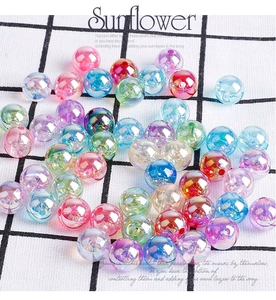 Detailed macro shot of translucent acrylic beads with colorful gradient and iridescent finish