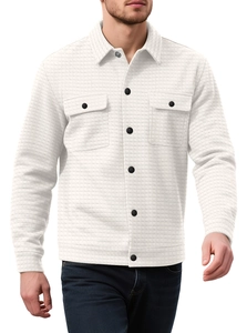 Detailed texture of white waffle knit shirt jacket with black buttons and chest pockets