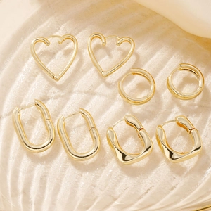 Minimalist gold plated earring set featuring heart, hoop, and geometric designs