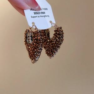 Detail of beaded heart earring with bronze faceted beads and 925 silver components